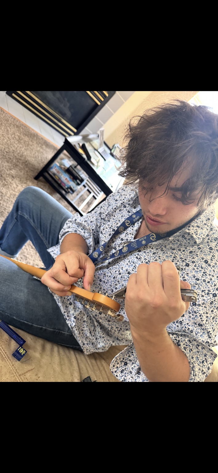 Sullivan McCusker playing guitar